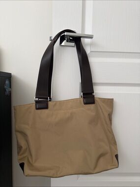 Tumi Beige Canvas Tote with Dark Brown Leather Straps